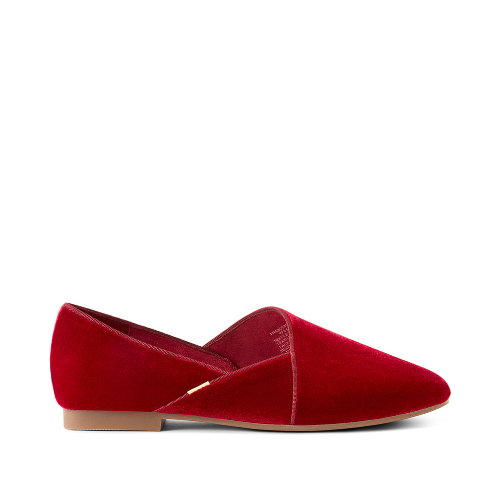Side profile of Luvons Francesca luxury loafer in Ruby Red featuring a soft velvet finish, brand accent detail, and supportive low heel for a polished, comfortable look.