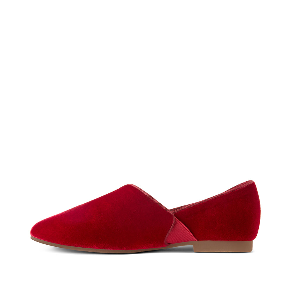 Profile view of Luvons Francesca luxury loafer in Ruby Red, crafted from rich velvet with a flexible gore and sleek silhouette for a refined, comfortable fit.